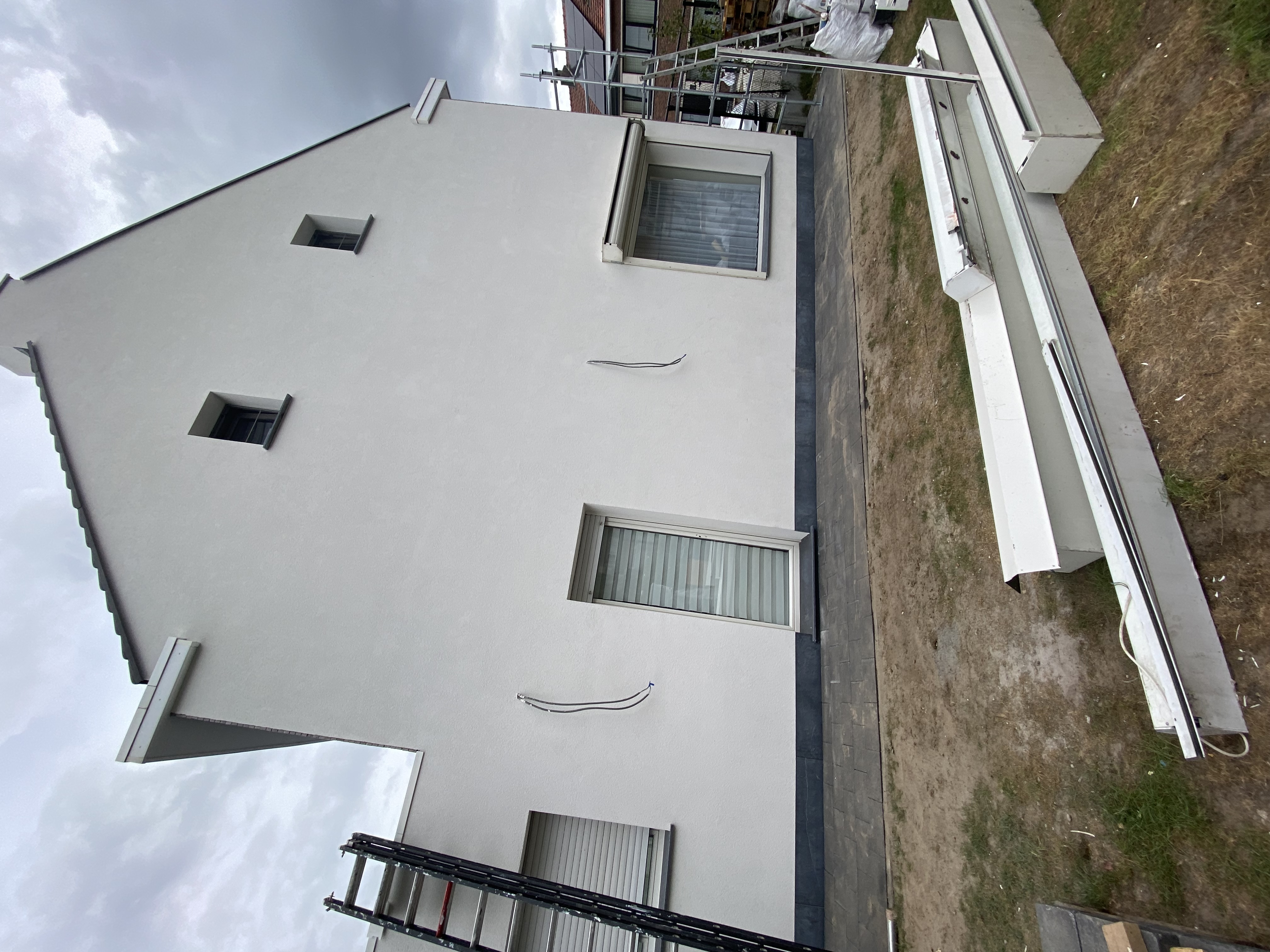 Dakisolatie, gevelrenovatie en buitenaanleg - Hoboken